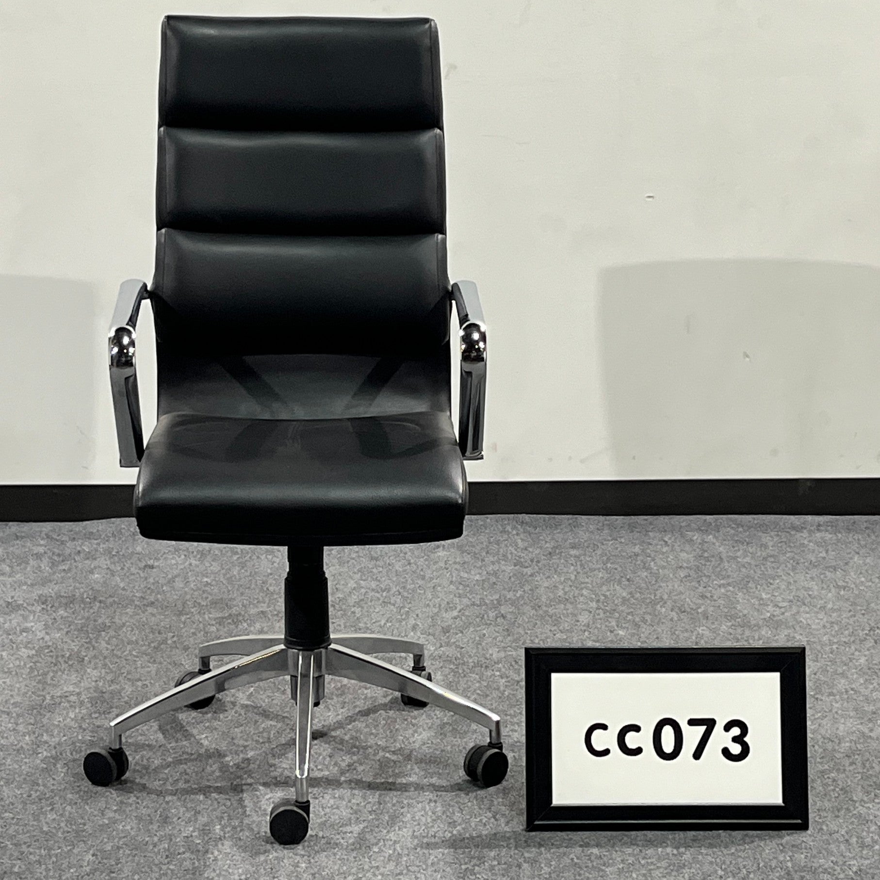 Showroom sample Black vinyl conference chair with chrome base