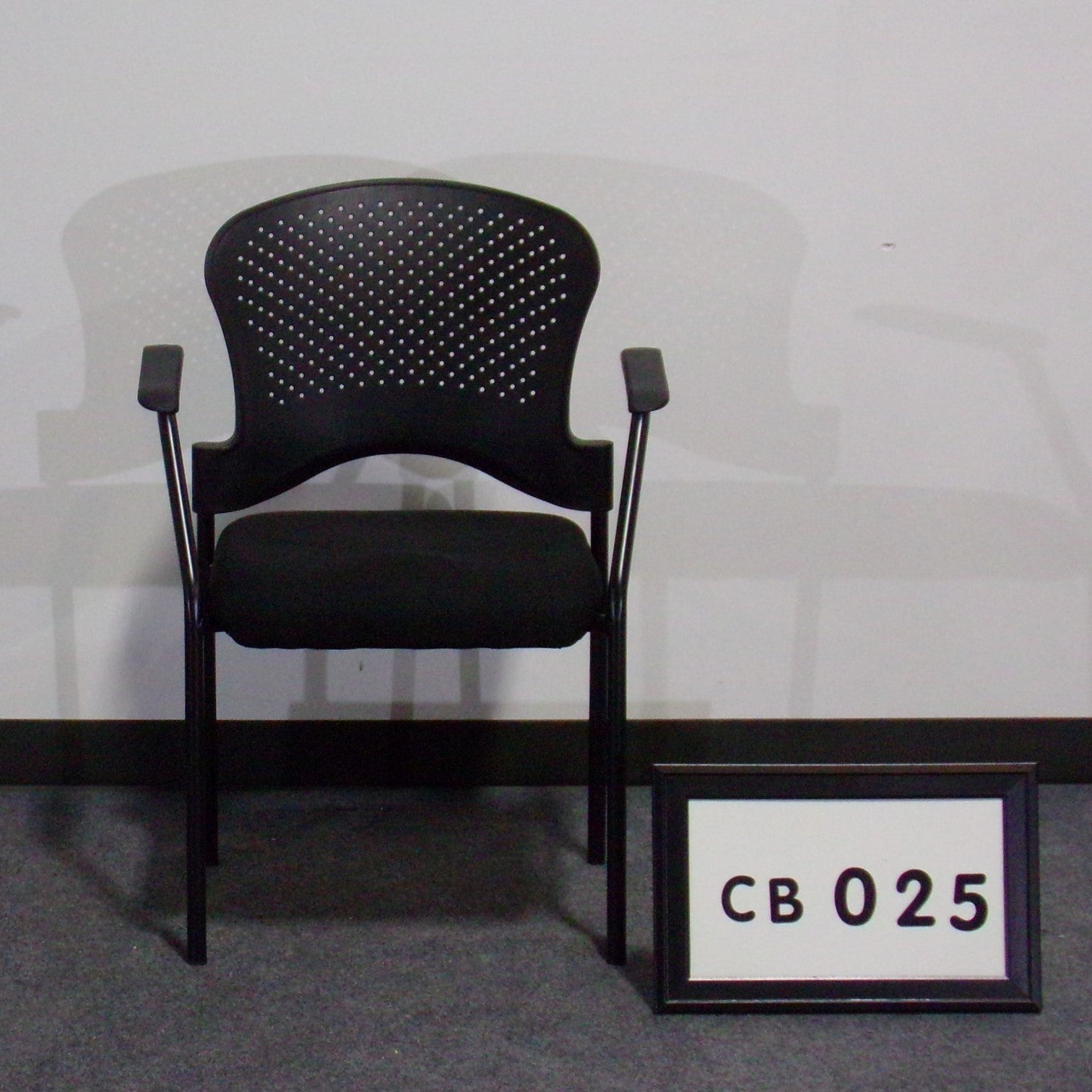 Side chair with padded black fabric seat poly back