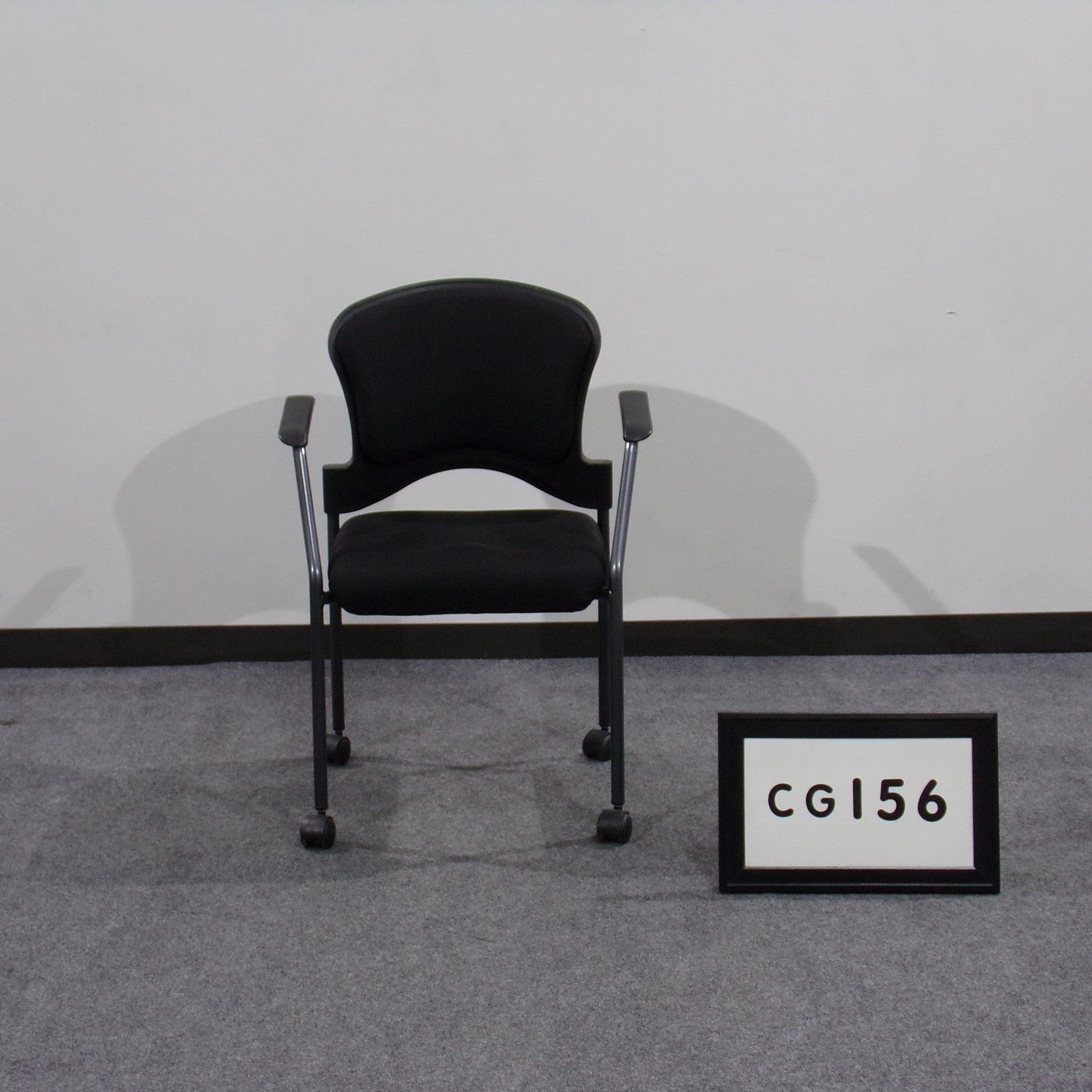 Guest chair- training room black fabric seat and back with casters
