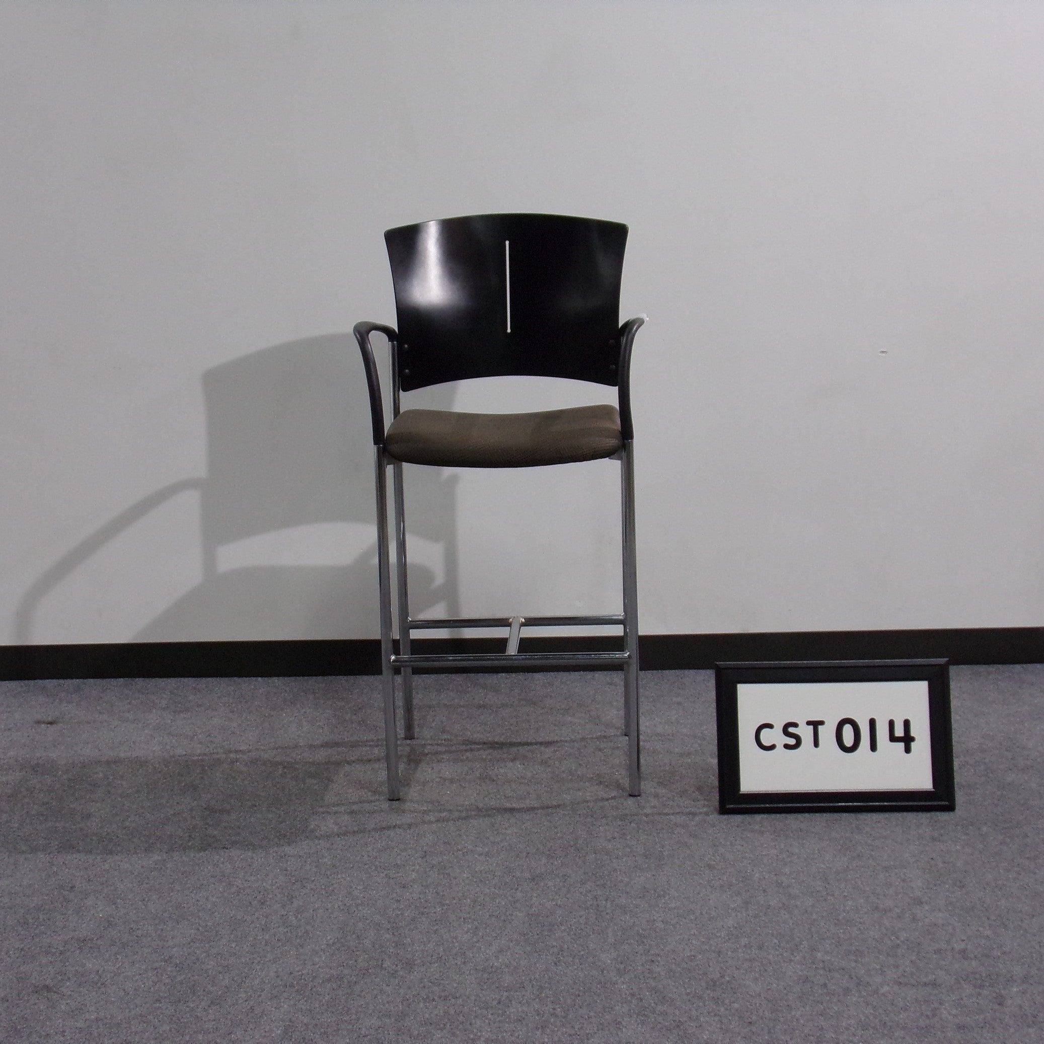 Source International stool Black wood back Black and gold patterned fabric seat Black plastic arm