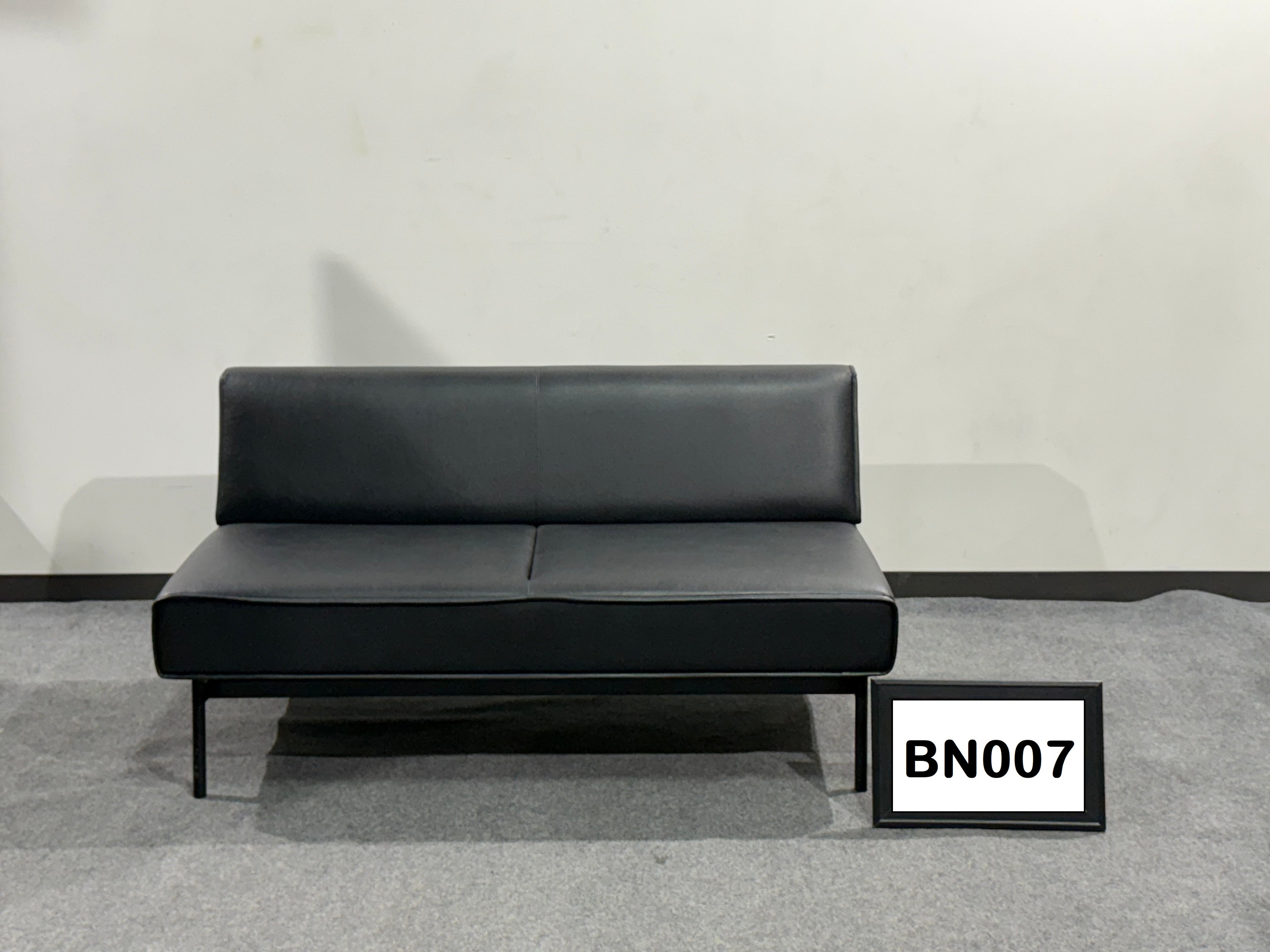 Black leather bench with metal legs 56" wide