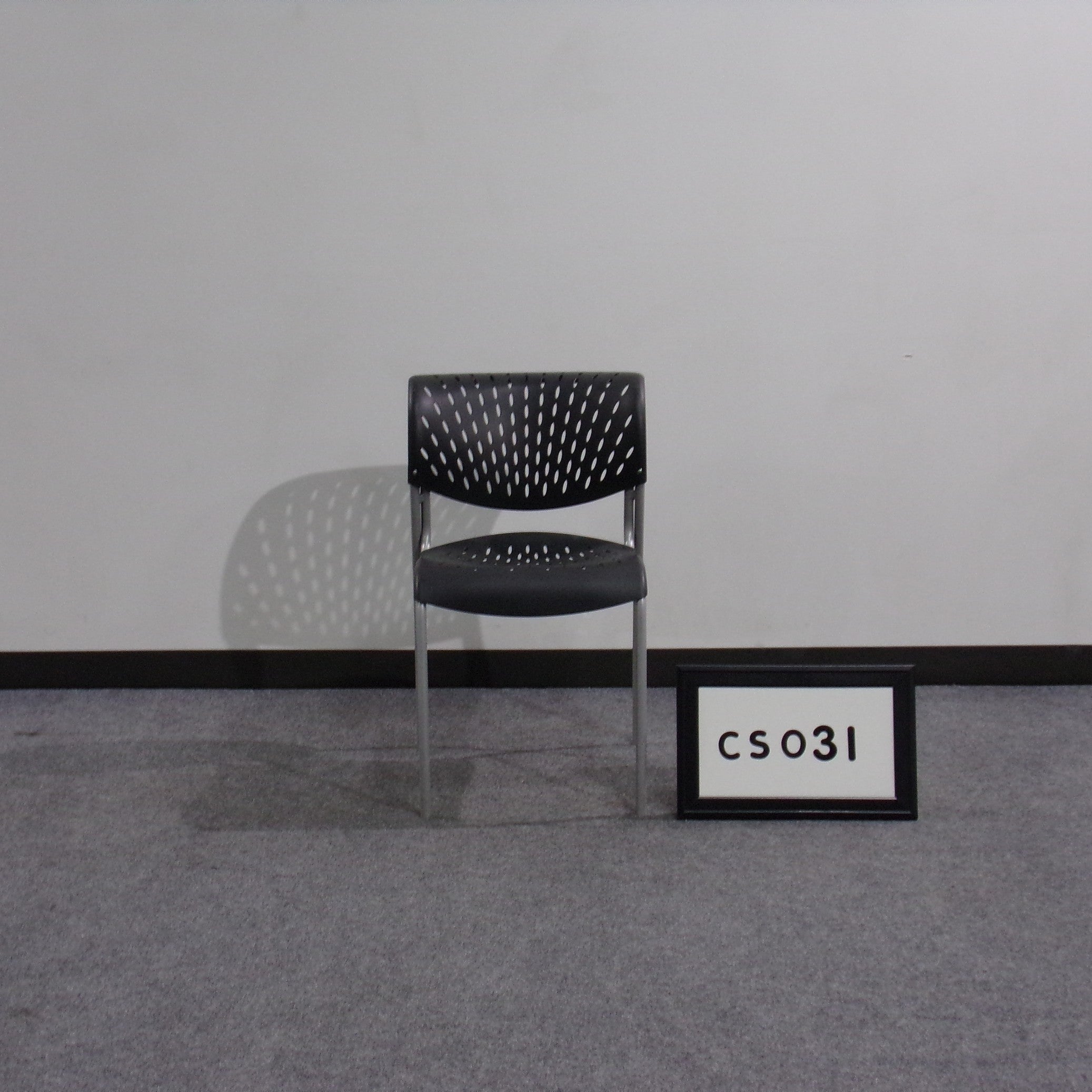 Izzy Design "Hannah" stack chair Vented black plastic seat and back