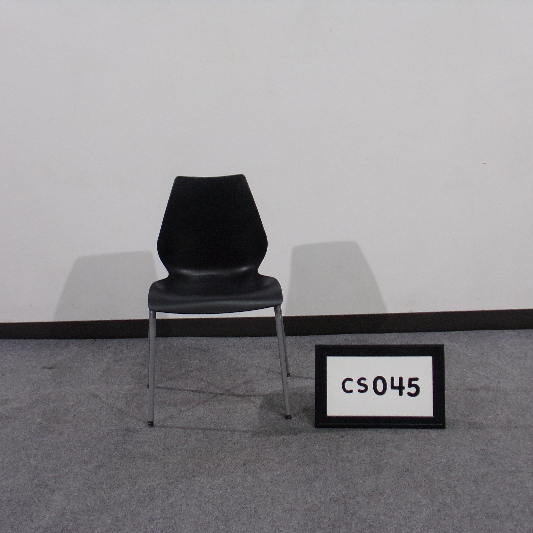 stack chair black with gray metal legs