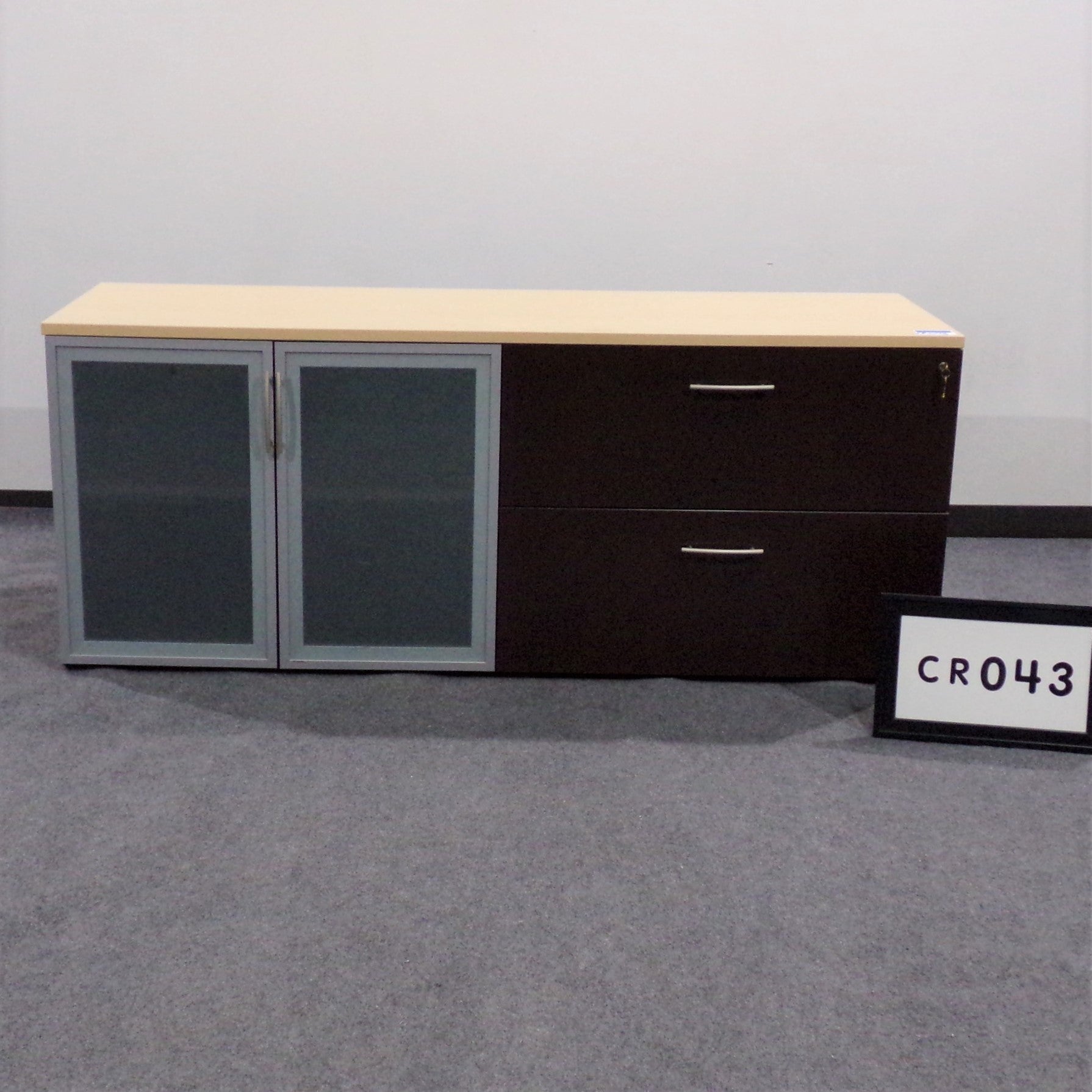 Maverick credenza Maple top, espresso base 2 door glass storage with one shelf 2 drawer lateral file