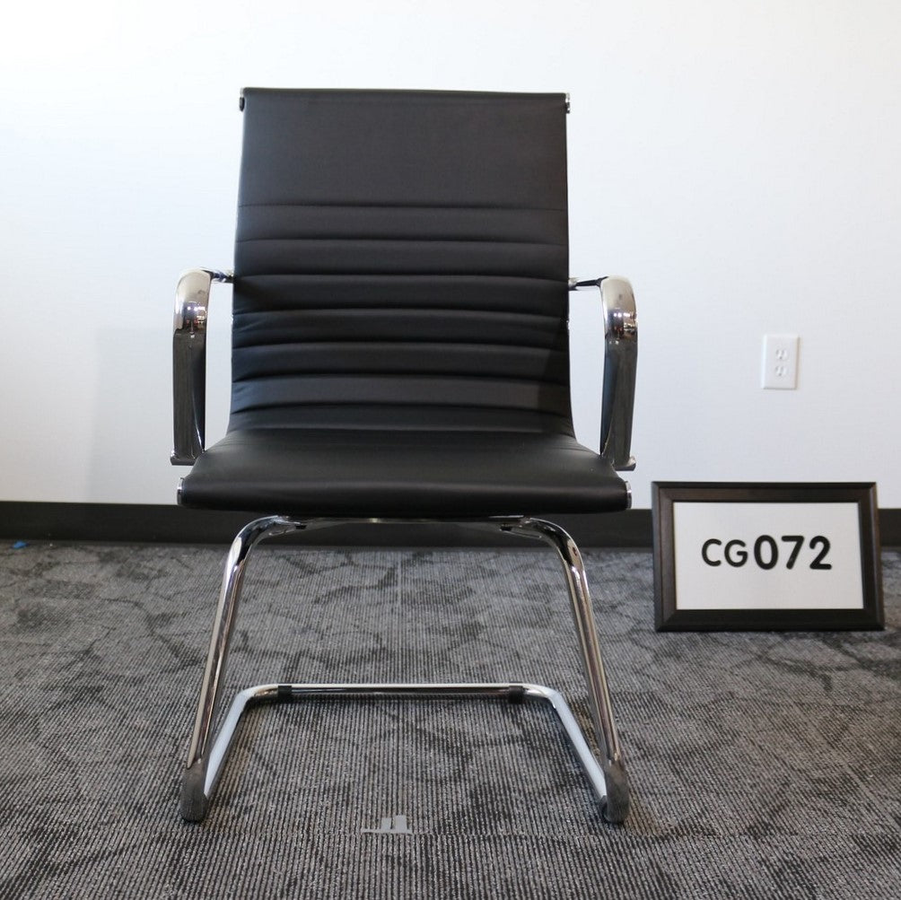 Black vinyl guest chair with chrome sled base
