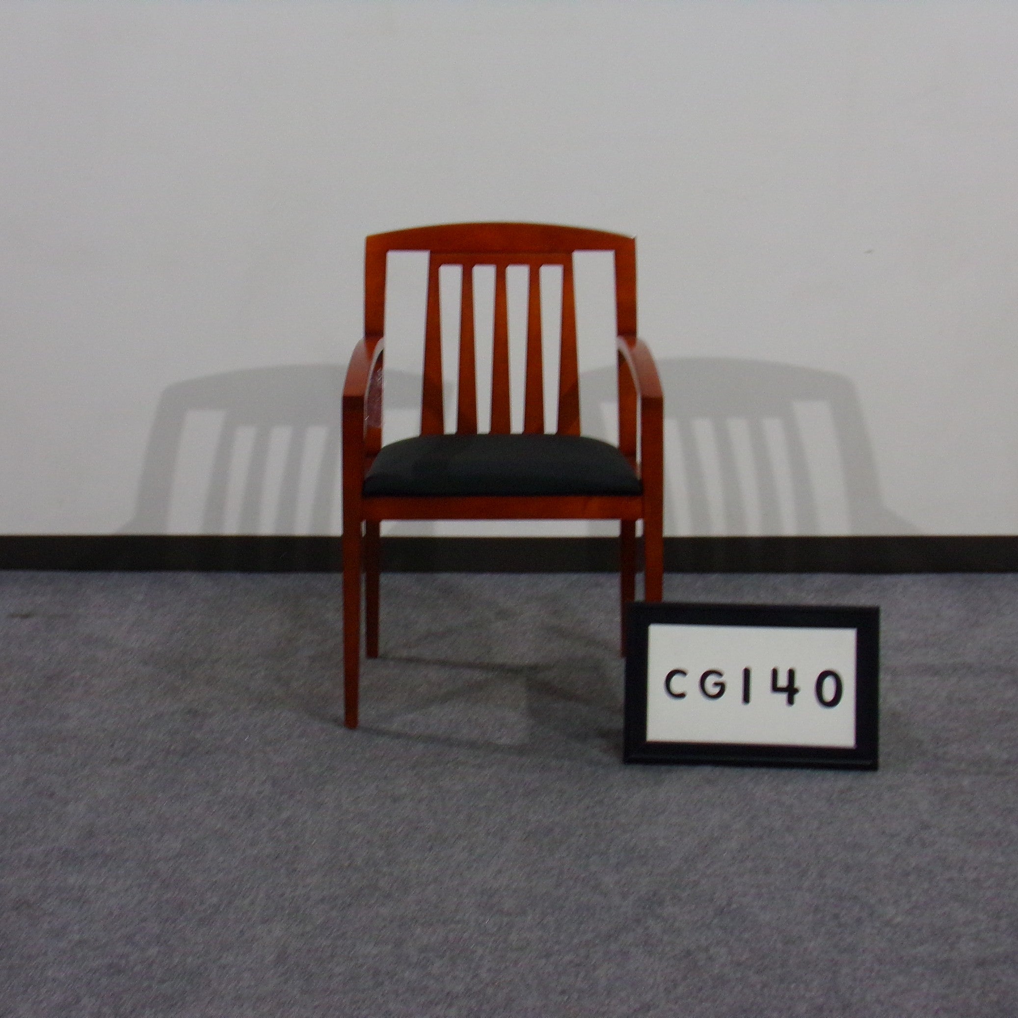 Cherry wood frame guest chair with vertical slat back. Seat recovered in black fabric