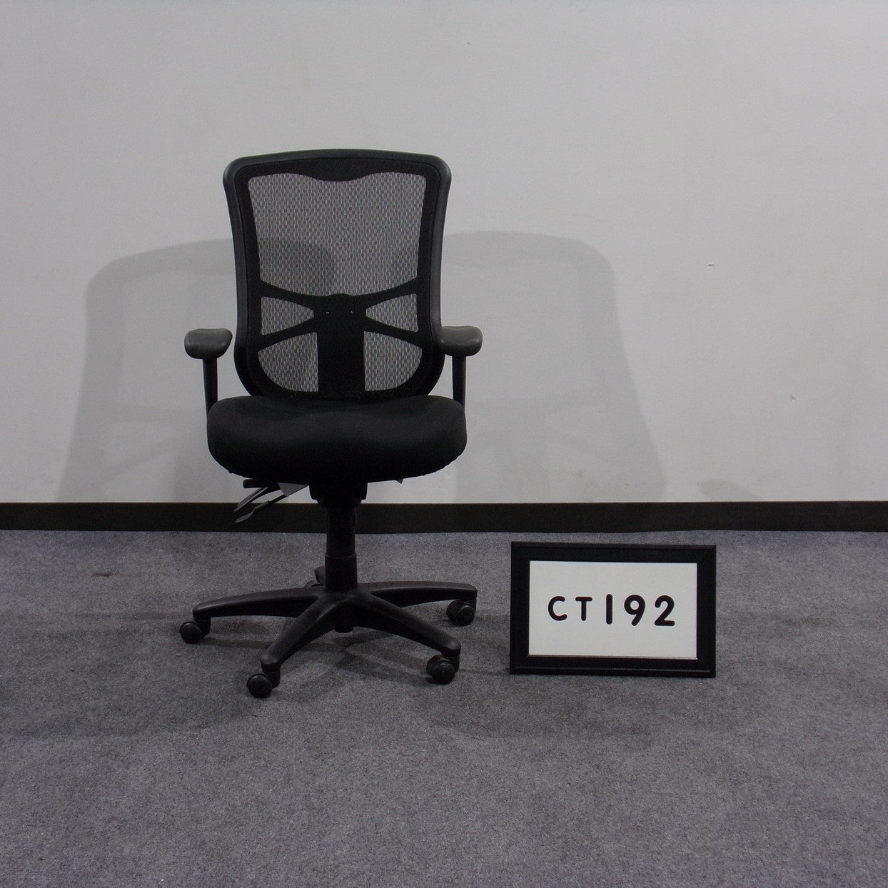 Task chair, black fabric seat and mesh back - no cover on back