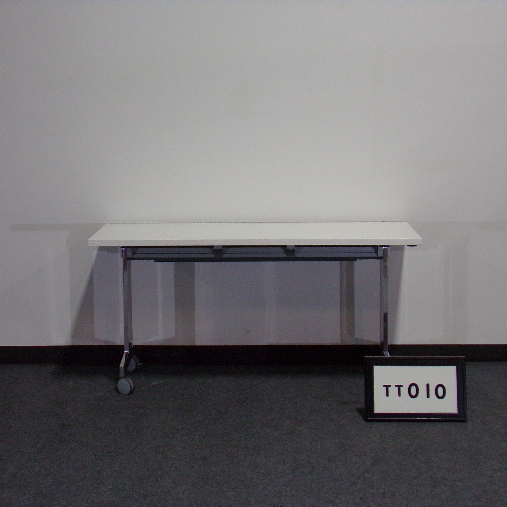 60" x 24" Haworth white laminate training table with fixed chrome legs