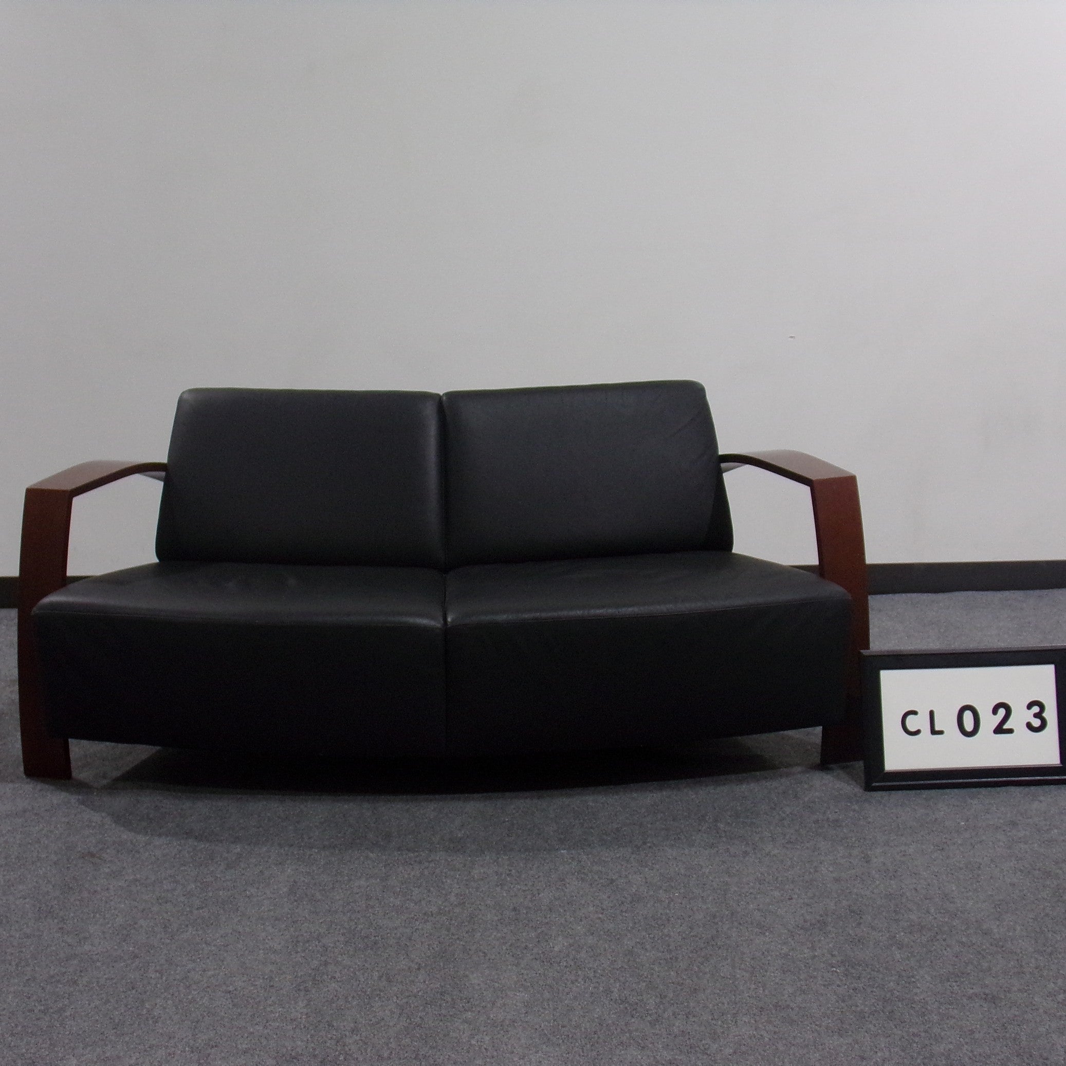 Niemkamper Canada Modern Love seat Black leather with cherry wood arms