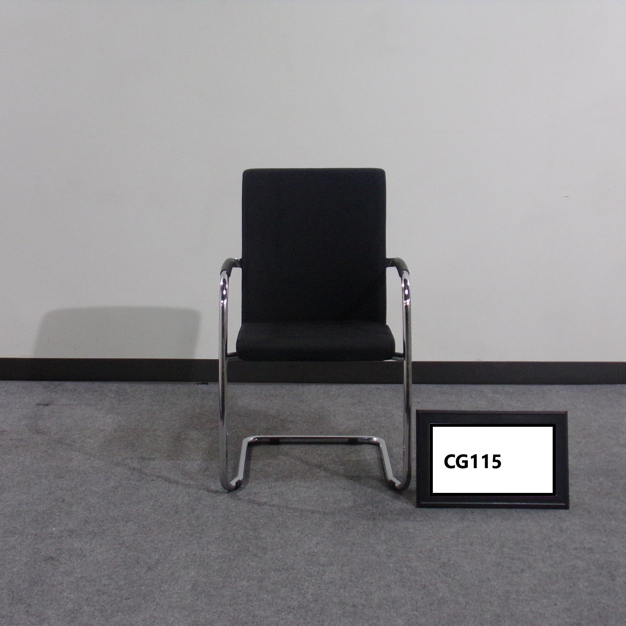 Guest chair Black fabric seat and back Tubular chrome base Black plastic arm pads