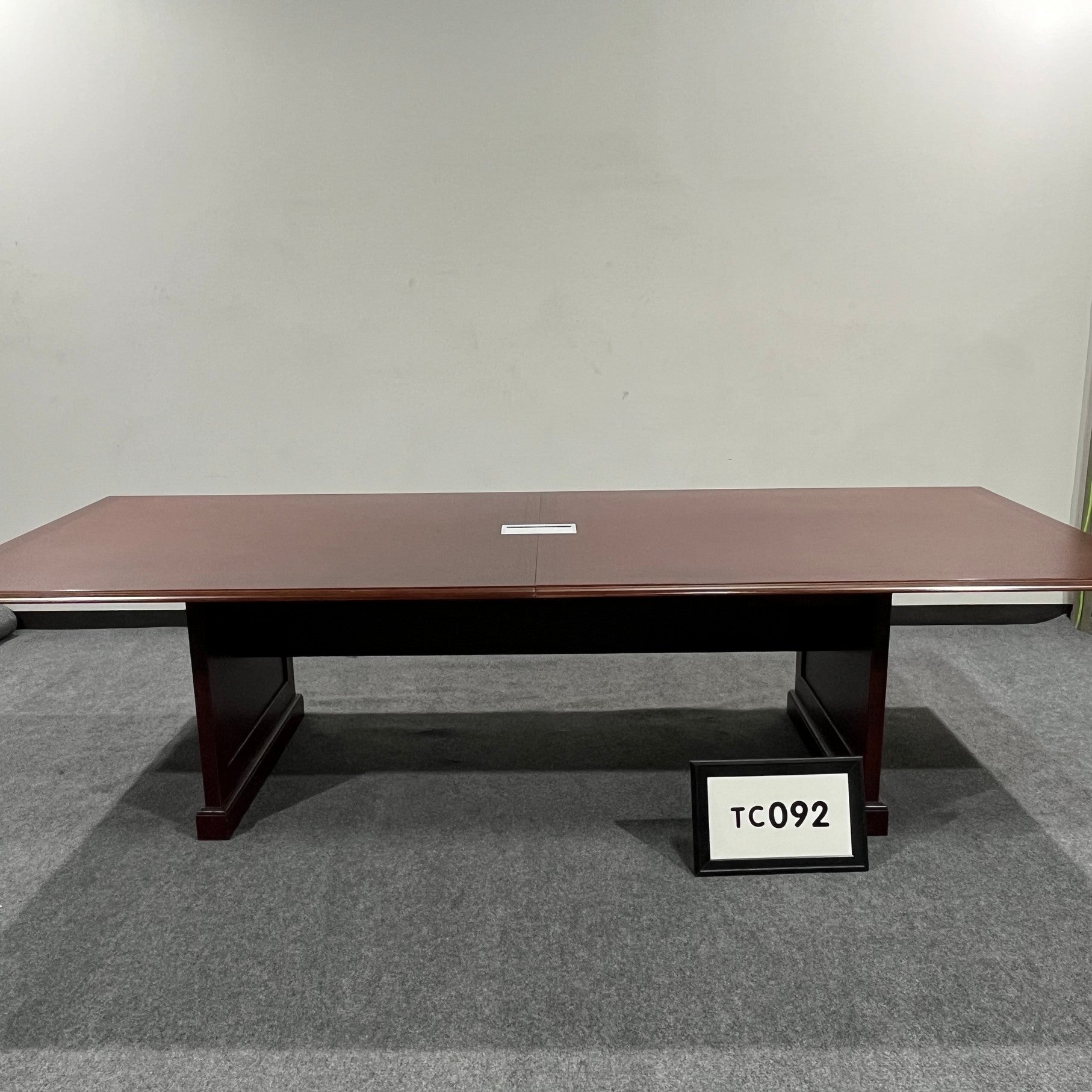 Mahogany Veneer Conference table with black inlay with grommet with slab base 10' x 4'