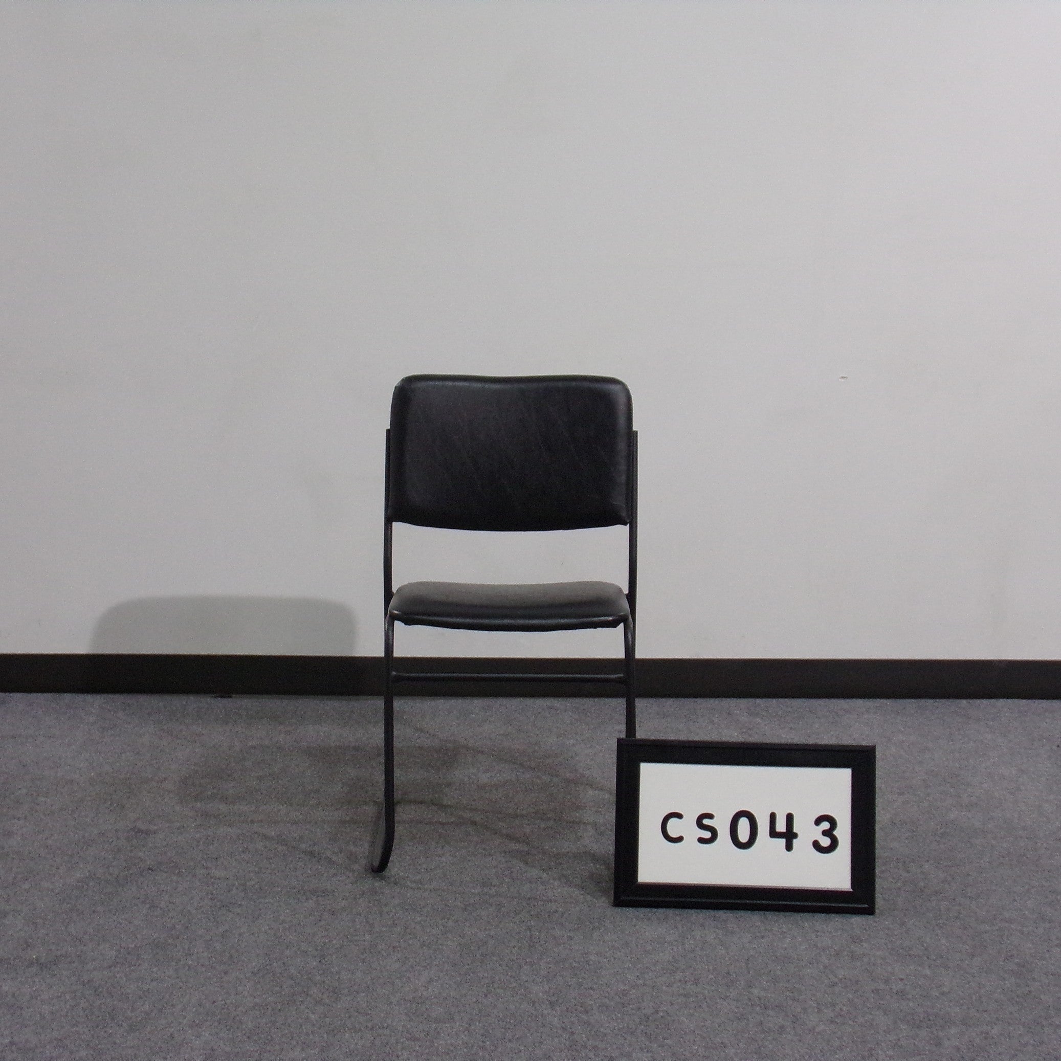 Black stack chair Vinyl seat and back Steel frame